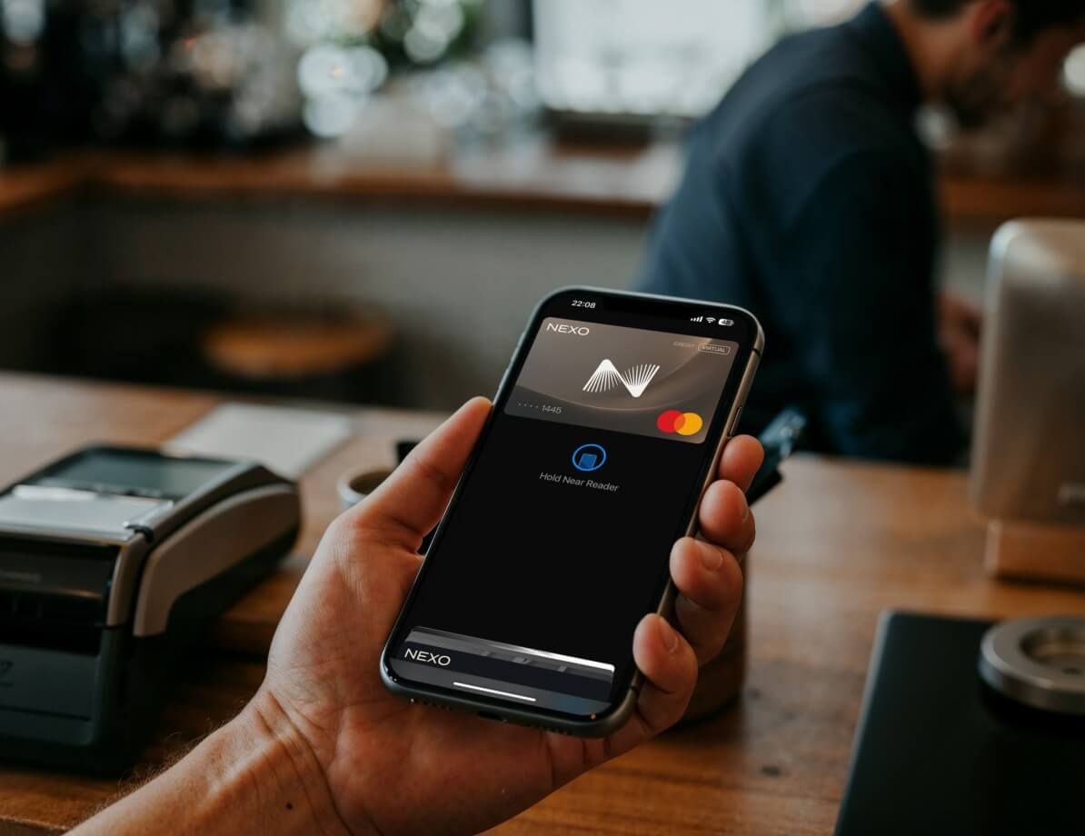 person paying with Nexo Card using Apple Pay